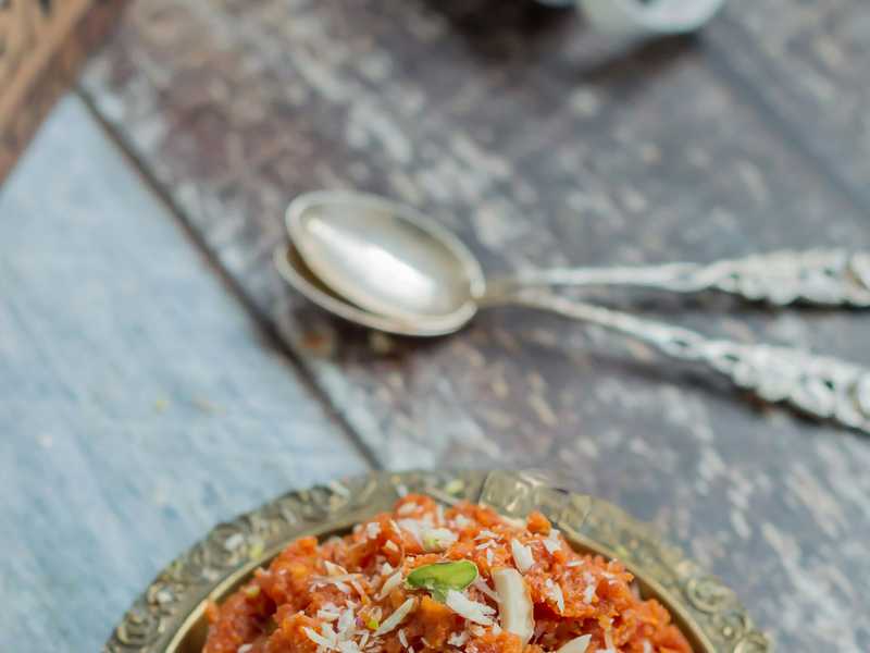 Gajar ka halwa – slow-cooked carrot pudding garnished with pistachios.